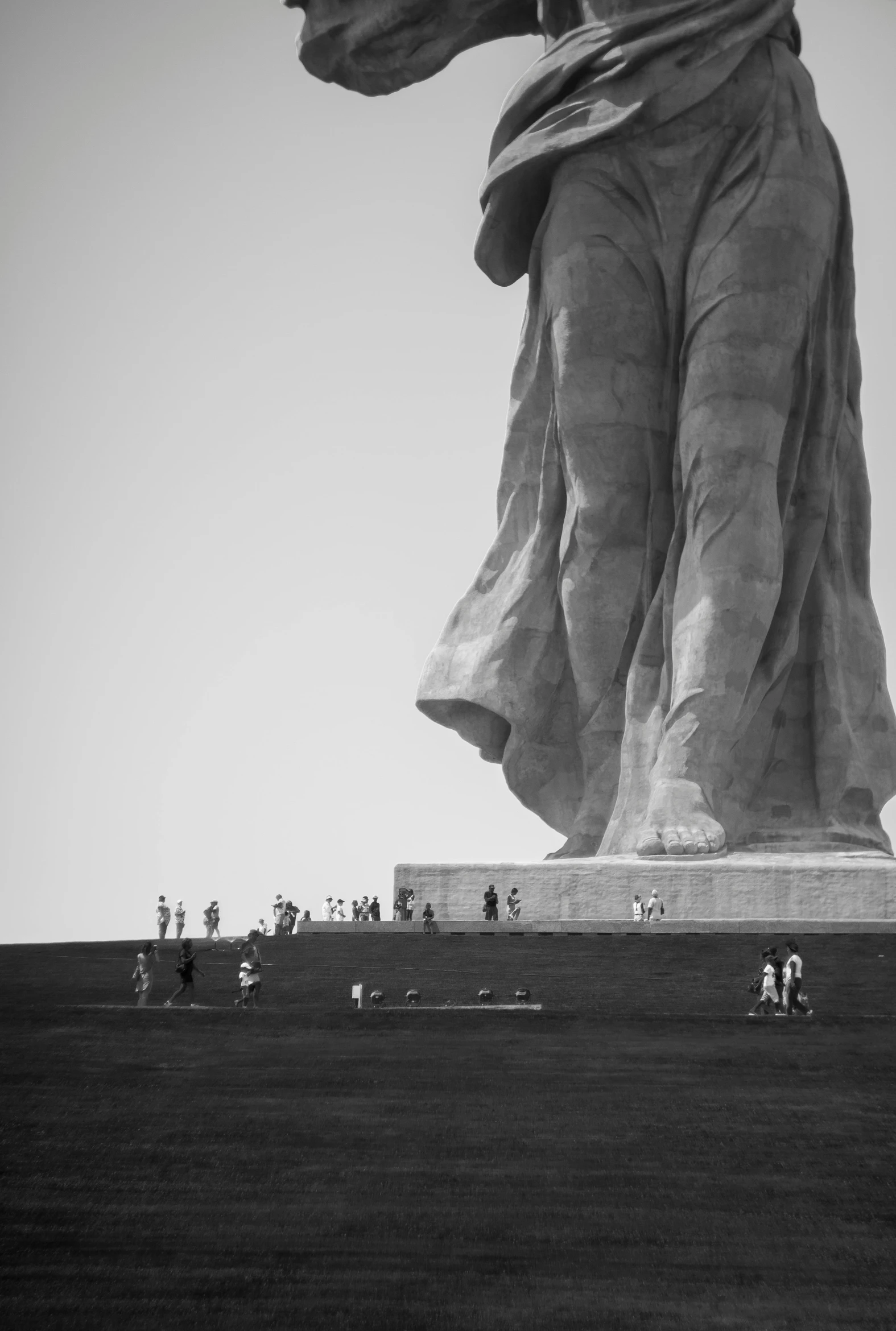 a black and white photo of the statue of liberty, by Joze Ciuha, surrealism, onlookers, nazare (portugal), concert, gigantic scale