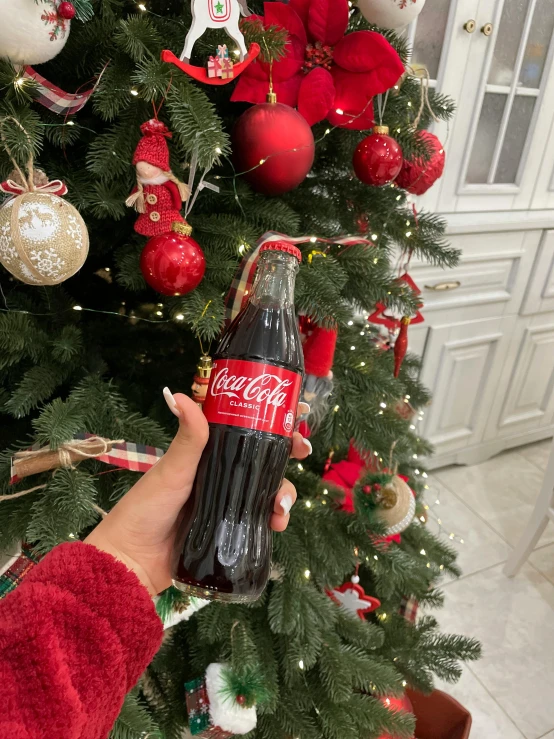 a person holding a coca cola bottle in front of a christmas tree, 8 к, profile image, ekaterina, 1 st winner