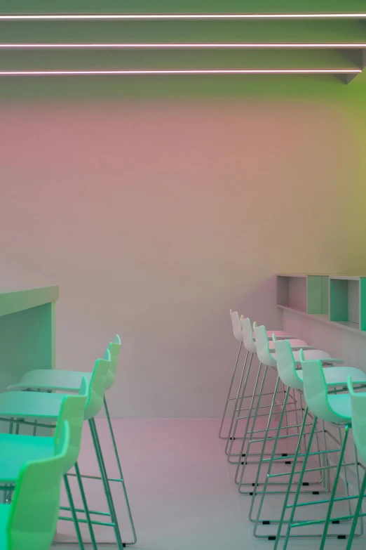 a room filled with lots of tables and chairs, a digital rendering, inspired by Reinier Nooms, trending on unsplash, light and space, neon gradient, ignant, empty stools, pink white and green