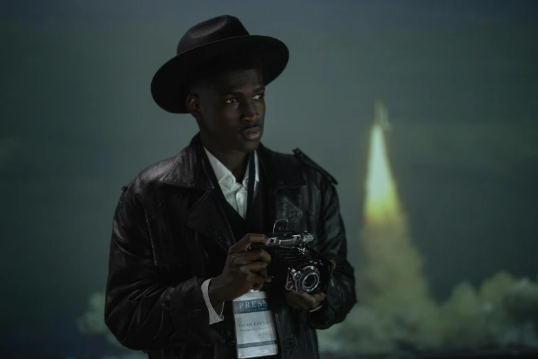 a man in a hat holding a camera, inspired by Gordon Parks, afrofuturism, spaceship in background, adut akech, **cinematic, moonlight