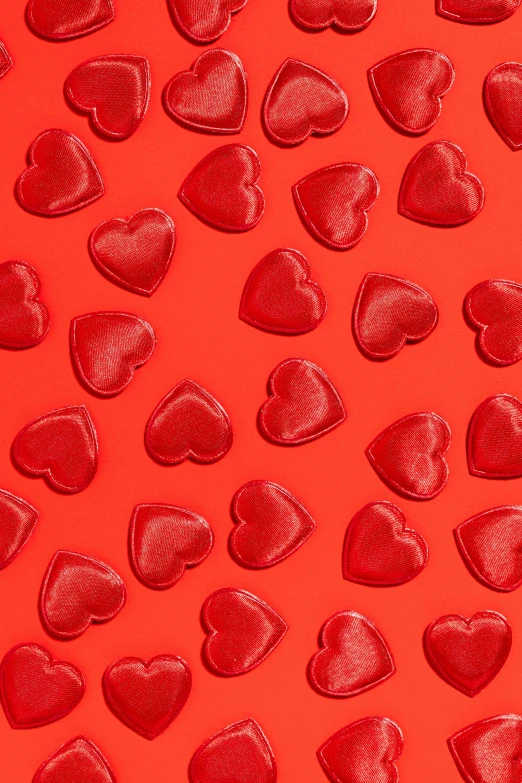 a lot of red hearts on a red background, trending on pexels, made of candy, 64x64, embossed, cosmopolitan