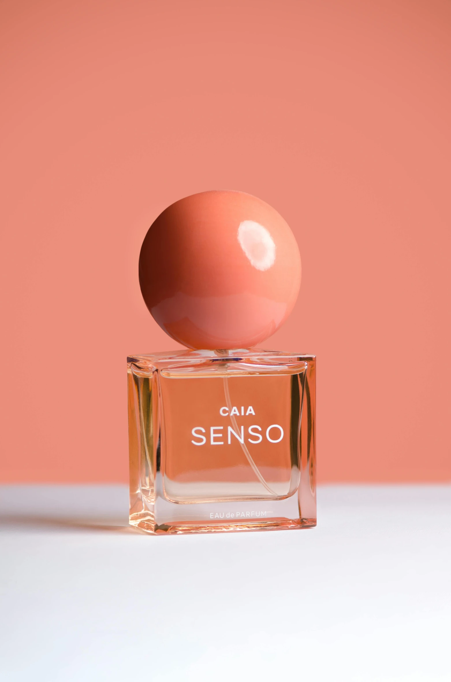 a bottle of perfume sitting on top of a table, inspired by Caro Niederer, sensor array, orange pastel colors, onsens, sense of movement