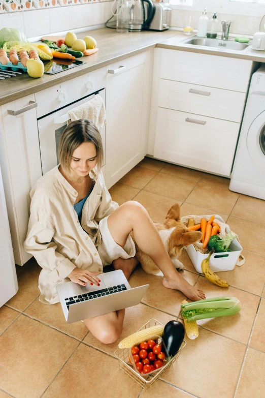 a woman sitting on the floor using a laptop, pexels contest winner, renaissance, veggies, fridge, messy clothes, breakfast