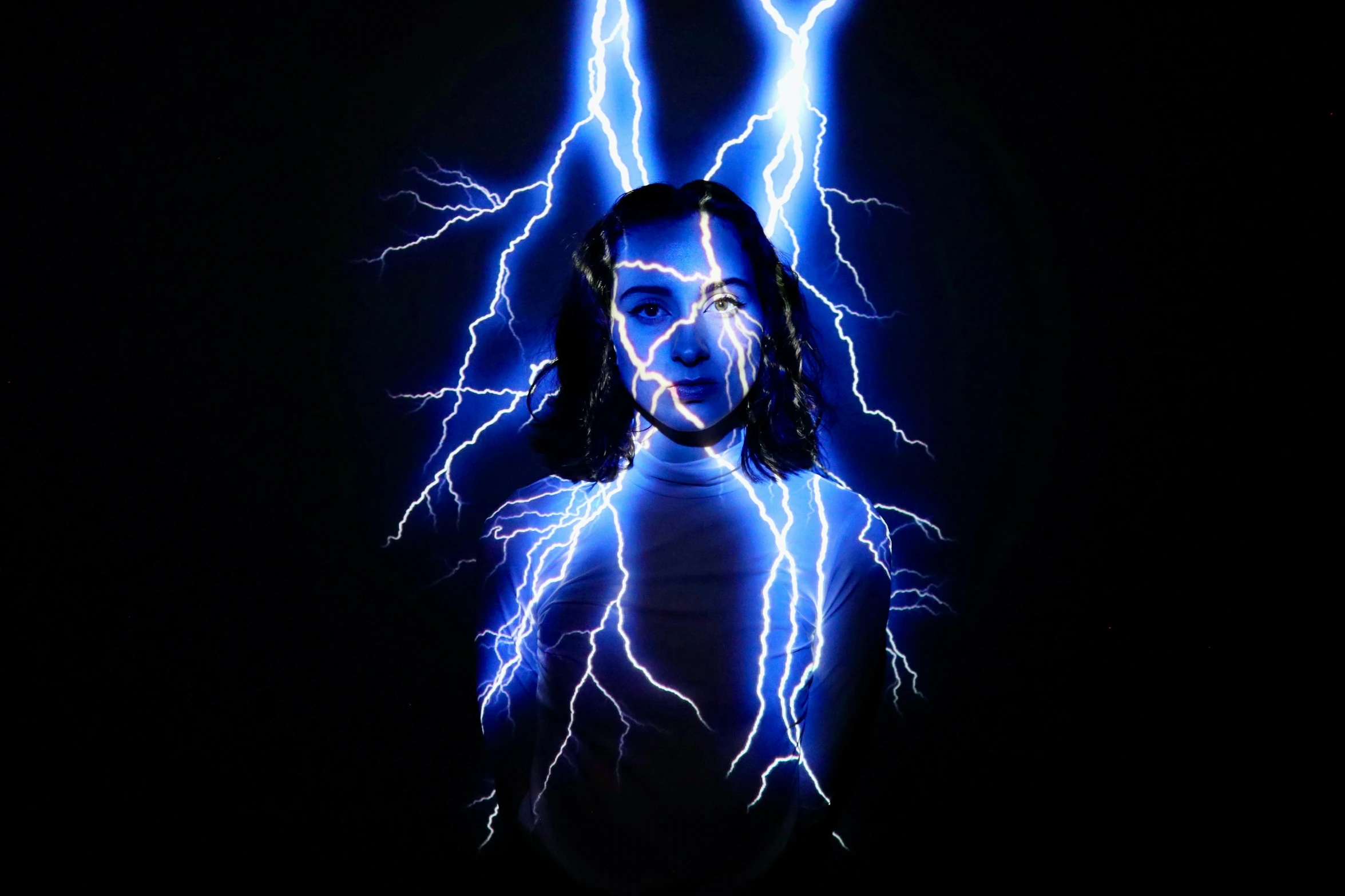 a woman that is standing in the dark, inspired by Storm Thorgerson, shock art, maya ali as a lightning mage, dua lipa, promo image, blue rays