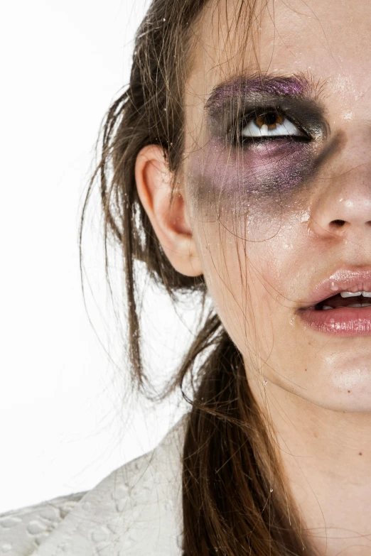 a close up of a person with makeup on, an album cover, inspired by Artemisia Gentileschi, trending on pexels, that violence breeds violence, broken lights, bruises, black eyed