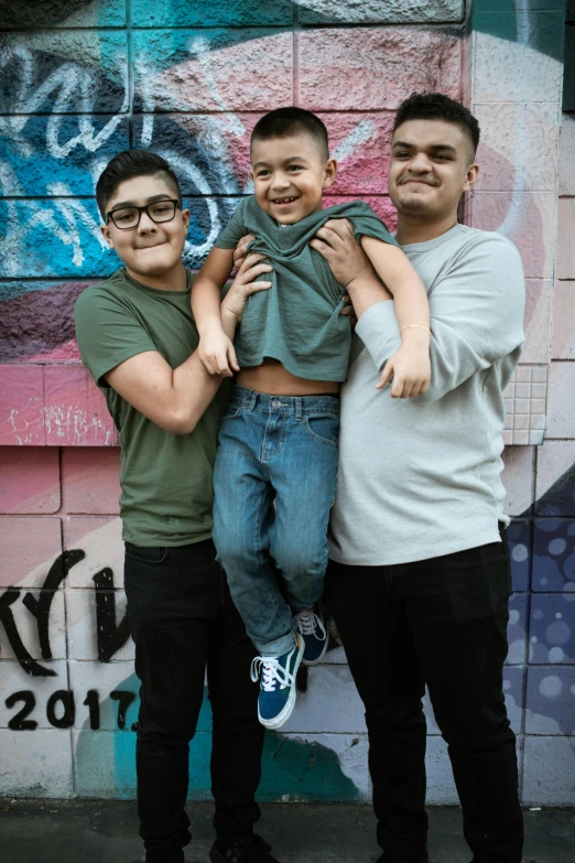 a group of three men standing next to each other, inspired by Randy Gallegos, pexels contest winner, with a kid, non-binary, tlaquepaque, panel
