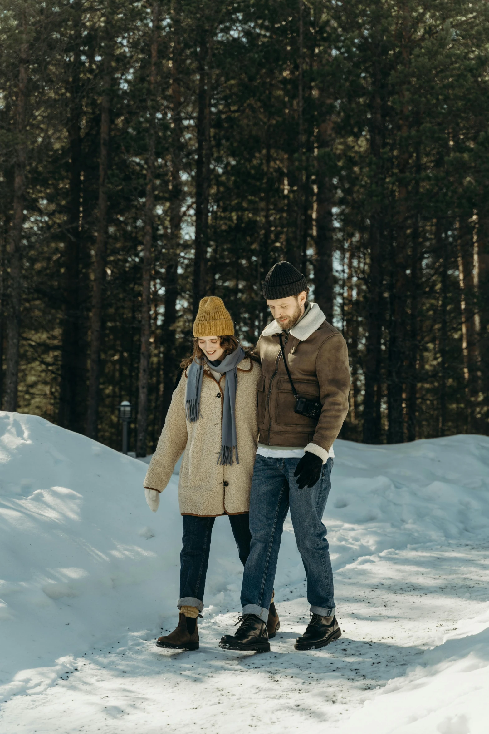 a man and a woman standing in the snow, cozy setting, walking in forest, in style of heikala, road trip