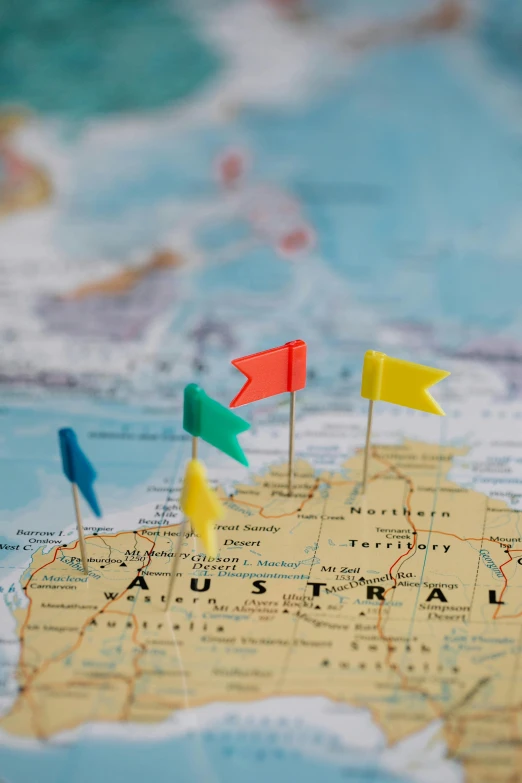 a map with a bunch of flags on it, by Jessie Algie, trending on unsplash, gold coast australia, yellow, toys, touring