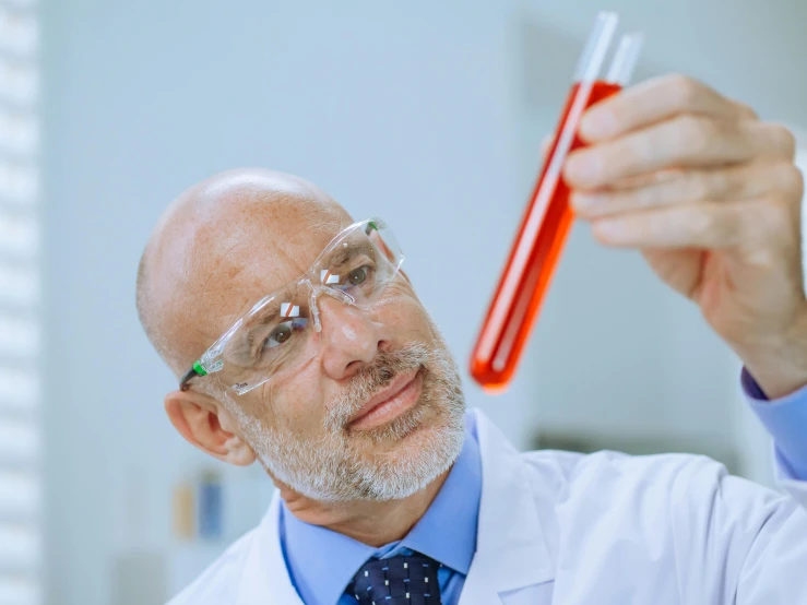 a man in a lab coat holding a test tube, a stock photo, shutterstock, some red water, 15081959 21121991 01012000 4k, bald, instagram post