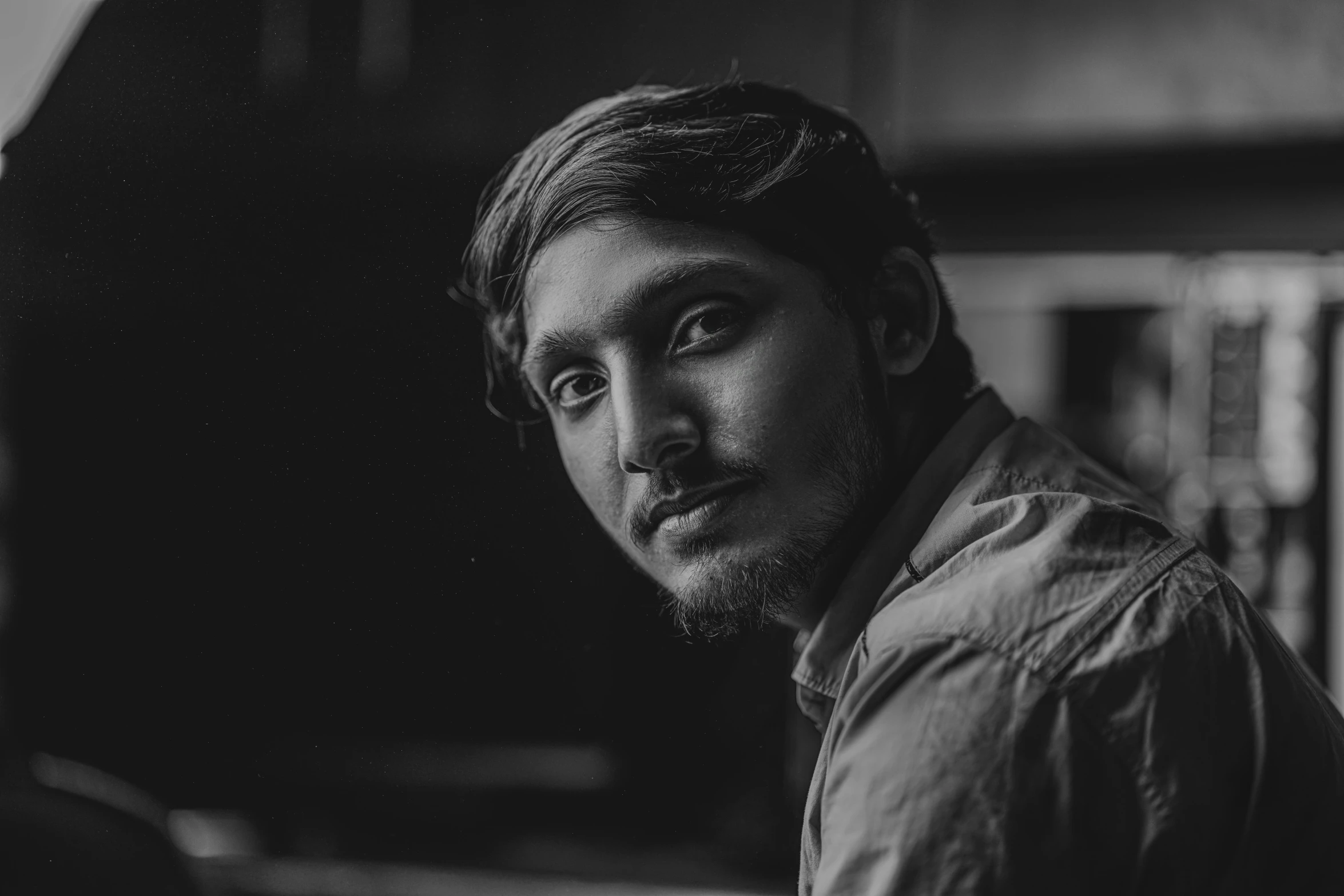 a black and white photo of a man with a beard, a black and white photo, pexels contest winner, jayison devadas, soft lighting and focus, color photograph portrait 4k, around 1 9 years old