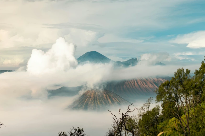 a group of people standing on top of a mountain, pexels contest winner, sumatraism, avatar image, volcanic background, floating lands in-clouds, single