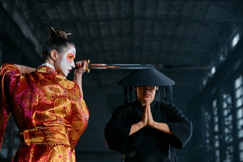 a man standing next to a woman holding a sword, inspired by Kanō Hōgai, pexels contest winner, performing on stage, square, hito steyerl, moon bear samurai