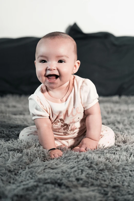 a baby sitting on top of a gray rug, a colorized photo, pexels contest winner, happening, happily smiling at the camera, portrait photography 4 k, 8k 50mm iso 10, hyperrealistic image