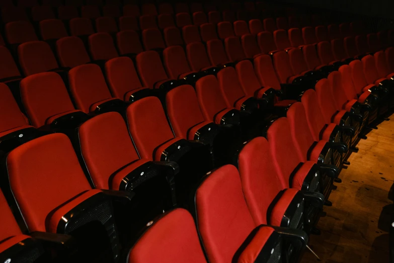 a couple of red chairs sitting next to each other, theatre equipment, thumbnail, multiple stories, profile image