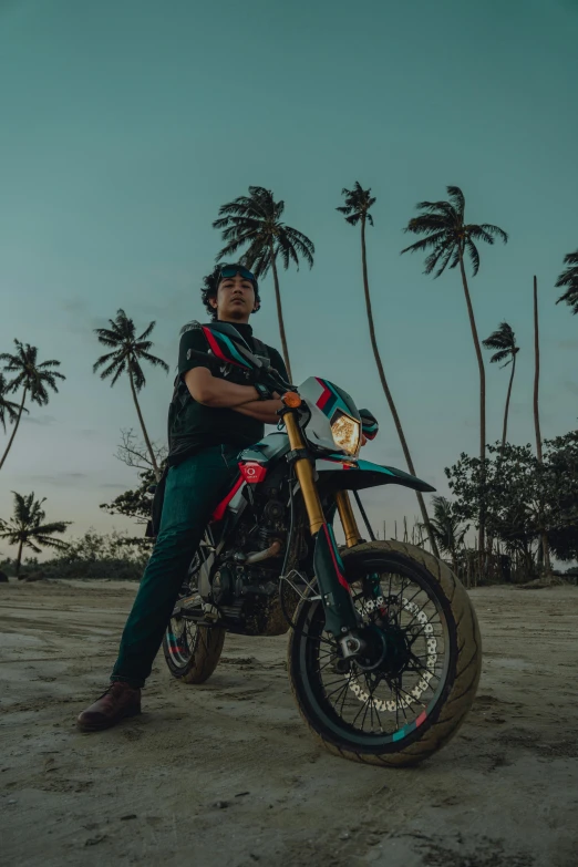 a man sitting on a motorcycle on a beach, an album cover, inspired by Jorge Jacinto, pexels contest winner, colombian jungle, portrait pose, evening time, avatar image