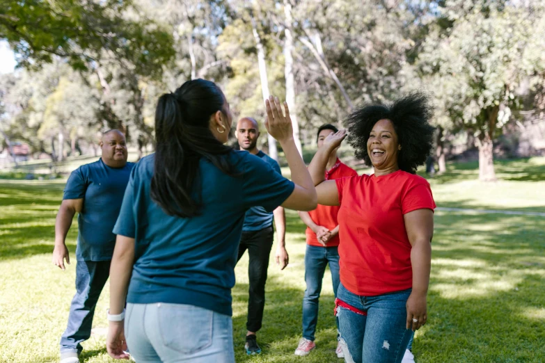 a group of people playing frisbee in a park, pexels contest winner, other women dancing behind, essence, fist fight, actors