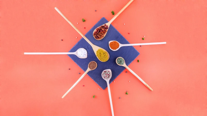 a bunch of spoons sitting on top of a blue plate, an album cover, pexels contest winner, antipodeans, spices, skewer, 9 9 designs, professional product shot