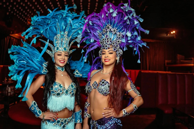 two women in costume standing next to each other, pexels contest winner, rasquache, gogo dancer, blue themed, jeweled headdress, various posed
