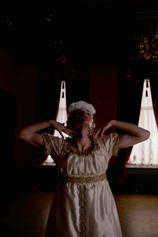 a woman in a white dress standing in a room, an album cover, inspired by Pietro Longhi, renaissance, live-action archival footage, blindfold, [ theatrical ], still frame from a movie