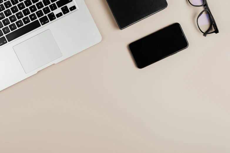 a laptop computer sitting on top of a desk next to a cell phone, trending on pexels, minimalism, taupe, background image, 9 9 designs, no - text no - logo