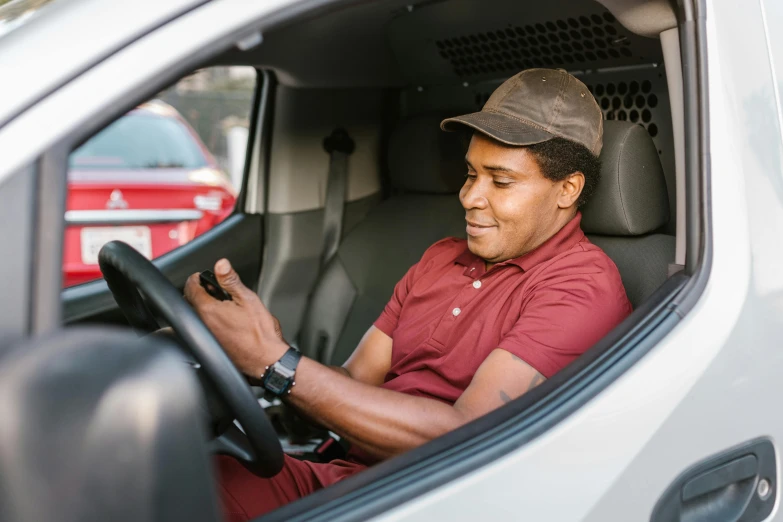 a man sitting in the driver's seat of a car, mkbhd, square, inspect in inventory image, view from a news truck