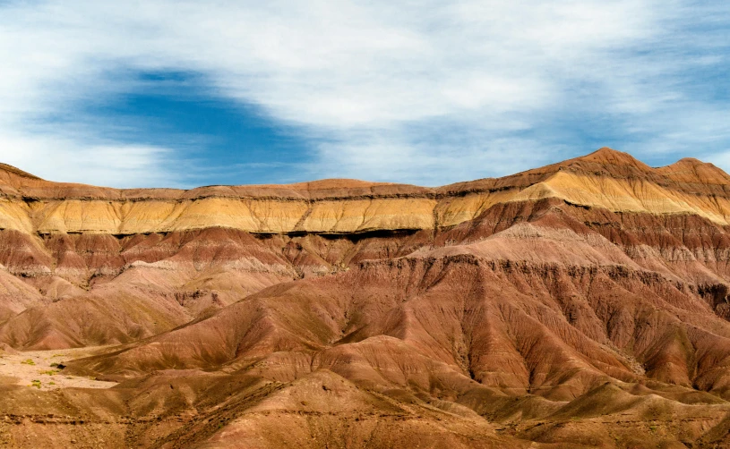 a scenic view of the painted hills of the painted hills of the painted hills of the painted hills of the painted hills of the painted hills of, trending on unsplash, les nabis, brown canyon background, low angle 8k hd nature photo, destroyed mountains, photo of shiprock