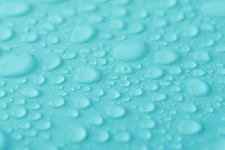 water droplets on a blue surface, trending on unsplash, plasticien, seafoam green, matte material, detailed product image, mid-shot