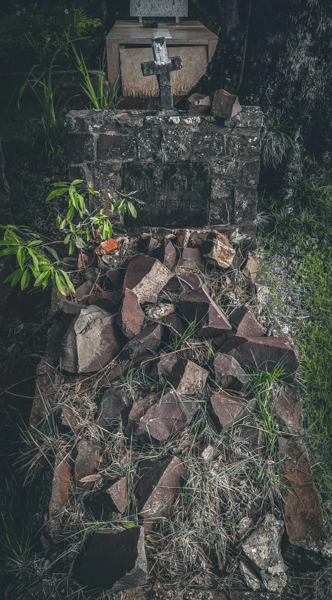 a pile of bricks sitting on top of a lush green field, an album cover, inspired by Elsa Bleda, unsplash contest winner, land art, abandoned overgrown graveyard, in a liminal underground garden, detailed medium format photo, instagram picture