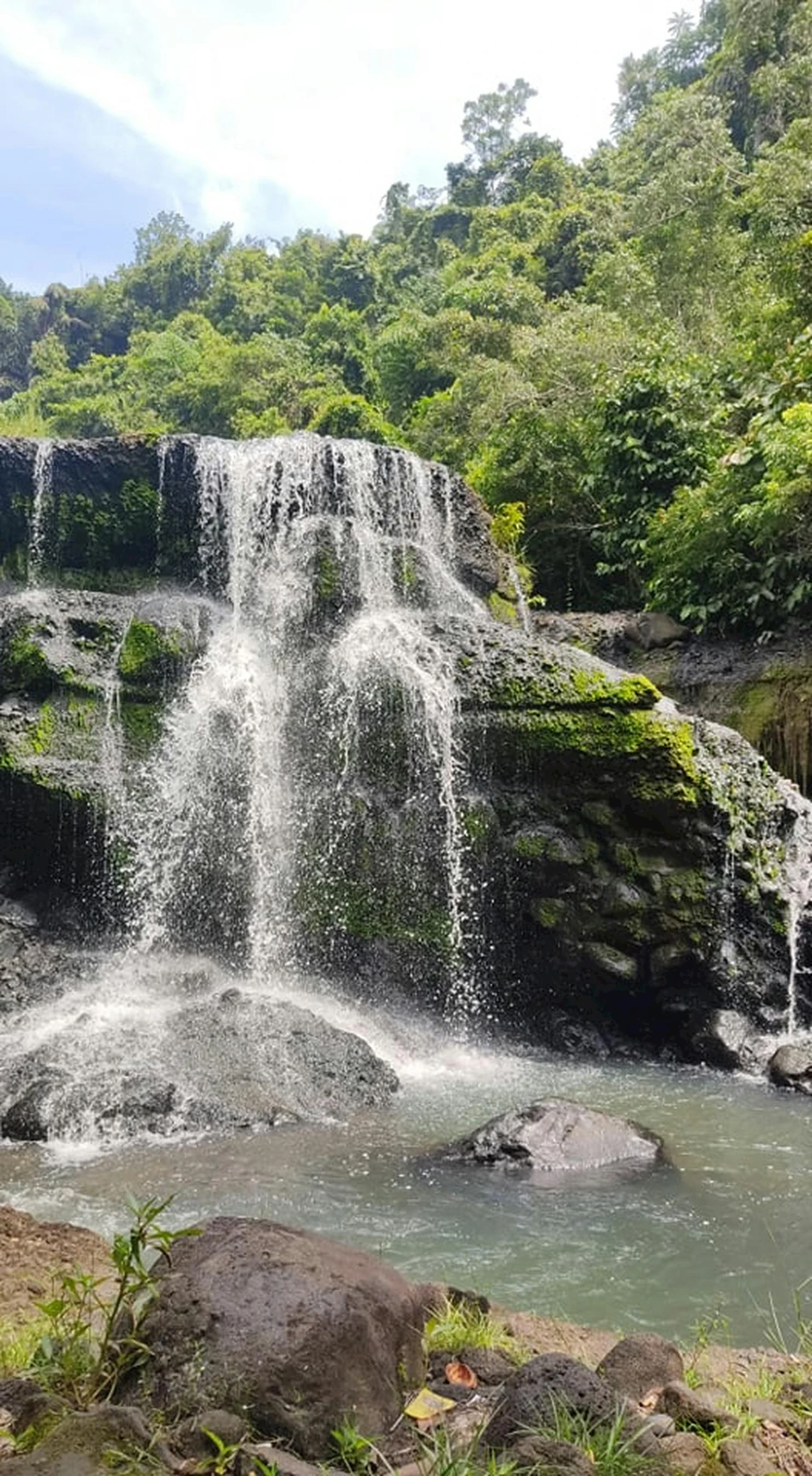 a waterfall in the middle of a lush green forest, sumatraism, thumbnail, puerto rico, 2019 trending photo, no crop