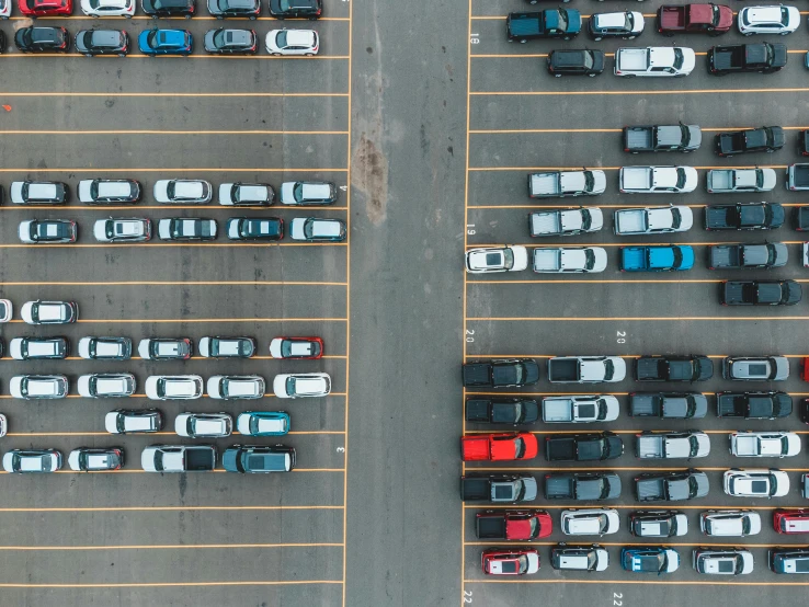 a parking lot filled with lots of parked cars, pexels contest winner, square lines, coloured photo, thumbnail, drone footage