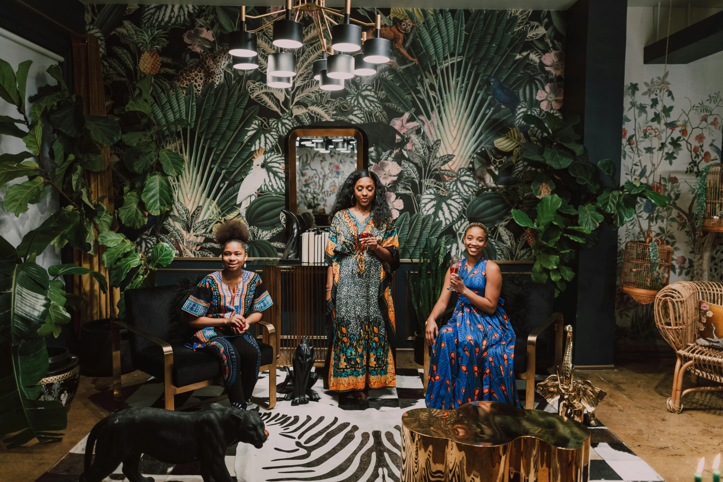 a group of people sitting in a living room, a portrait, maximalism, african ameera al taweel, lush surroundings, black african princess, full body image