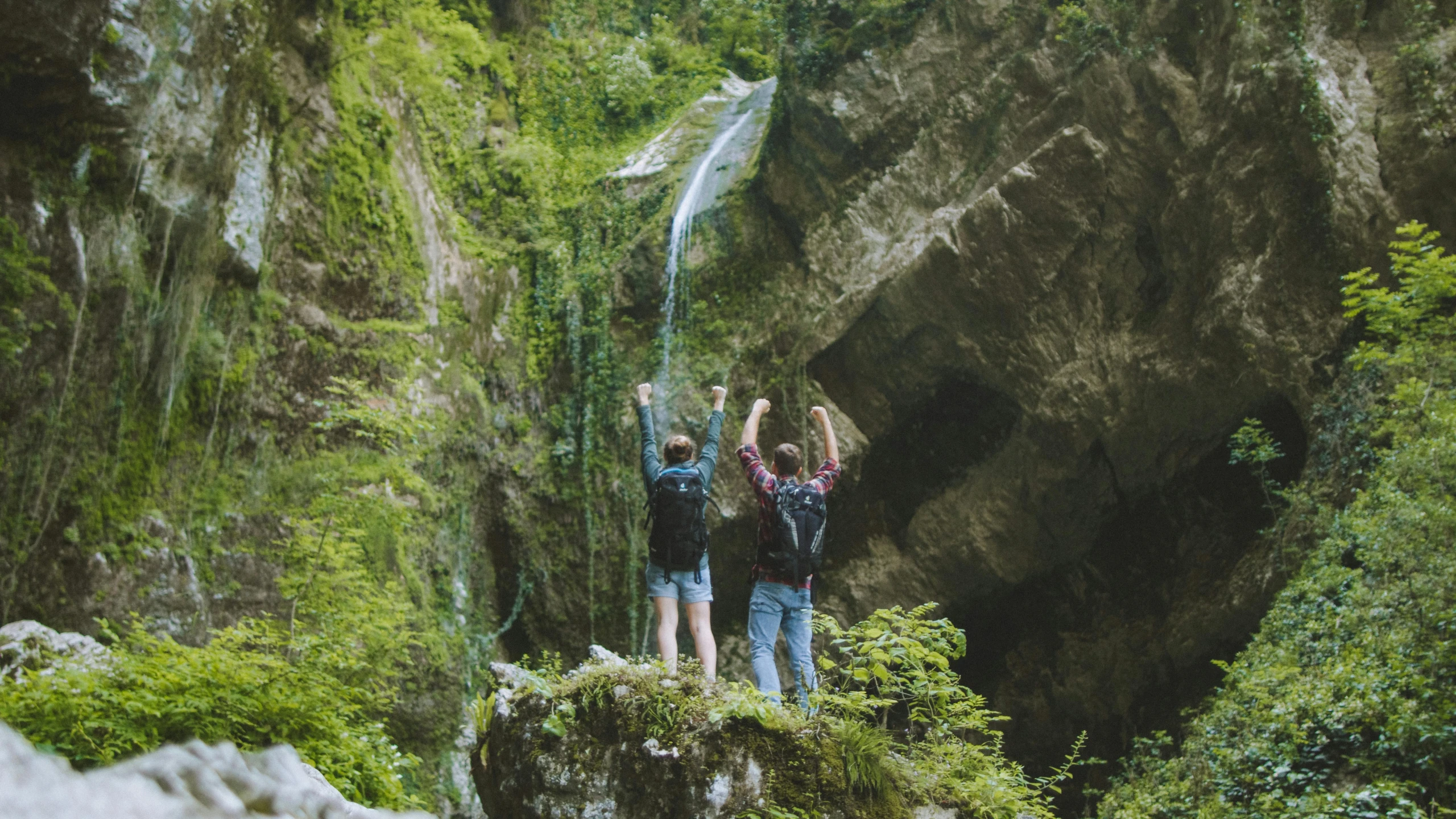 a group of people standing in front of a waterfall, pexels contest winner, renaissance, over a chalk cliff, avatar image, outdoor photo, medium shot of two characters