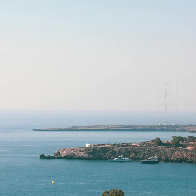 a man flying a kite on top of a lush green field, pexels contest winner, les nabis, ships in the harbor, cyprus, hazy water, three masts