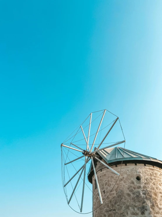 a windmill with a blue sky in the background, by Niko Henrichon, pexels contest winner, renaissance, cyprus, thumbnail, multiple stories, 15081959 21121991 01012000 4k