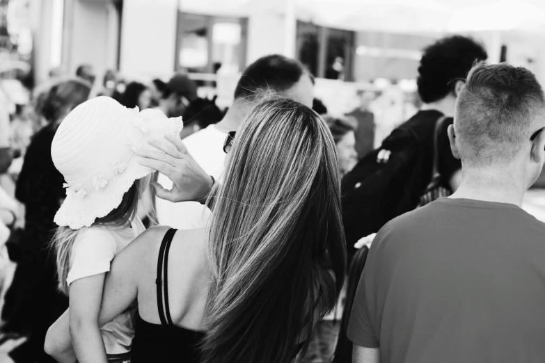 a black and white photo of a crowd of people, a black and white photo, by Silvia Pelissero, pexels, renaissance, hair, people shopping, frosting on head and shoulders, long hair