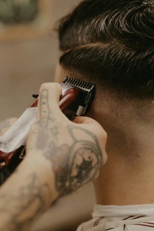 a man getting his hair cut at a barber shop, a tattoo, trending on pexels, sharply shaped, deeply hyperdetailed, boy hair, diecut