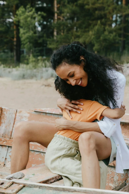 a woman sitting on top of a wooden boat, hugging each other, sitting on a park bench, with a kid, ashteroth