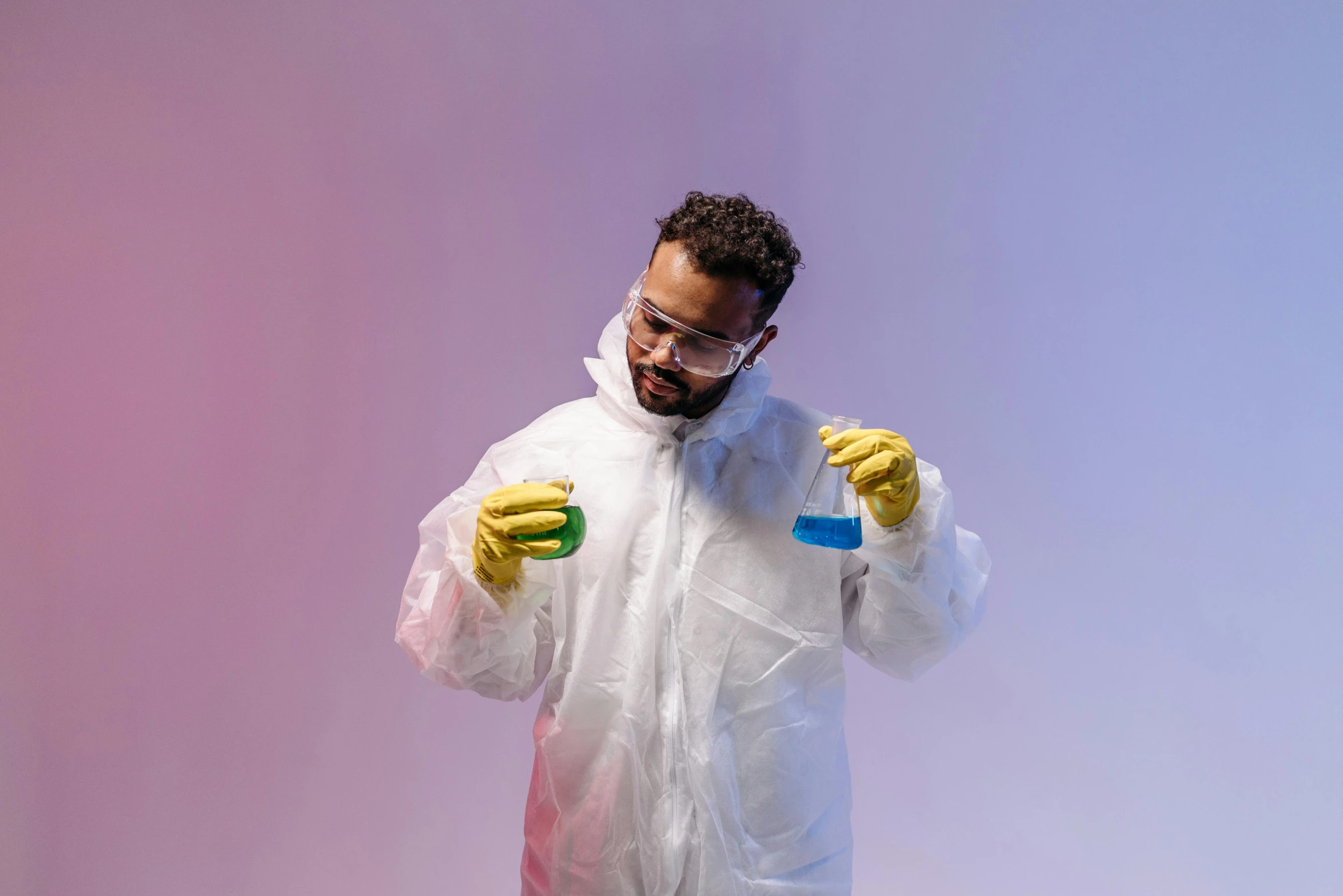 a man in a protective suit holding a bottle of liquid, pexels contest winner, process art, beakers of colored liquid, lab coat and tee shirt, avatar image, afro tech