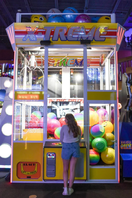 a woman standing in front of a vending machine, arcade game, discovery zone, extreme rage, kids place