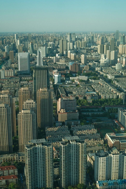 an aerial view of a city with tall buildings, inspired by Cheng Jiasui, flickr, square, baotou china, savannah, wide open city ”