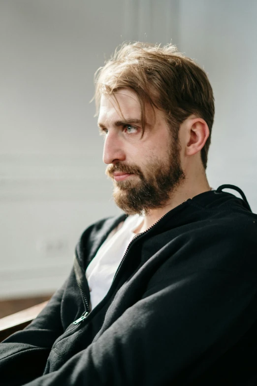 a man with a beard sitting in a chair, looking smug, style of maciej kuciara, pouty, discord profile picture