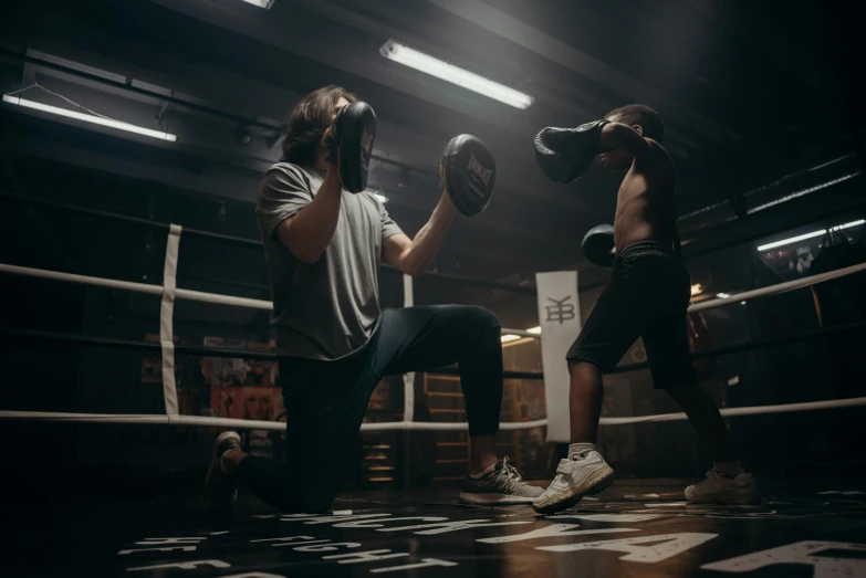 a couple of men standing next to each other in a boxing ring, by Emma Andijewska, working out, pitch black room, profile image, thumbnail