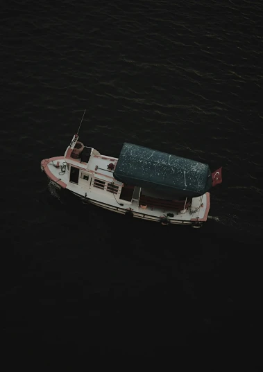 a small boat floating on top of a body of water, by Elsa Bleda, on a dark background, drone footage, high quality photo, ansel ]