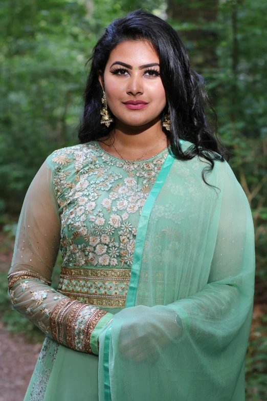 a woman in a green dress posing for a picture, assamese aesthetic, 2 5 6 x 2 5 6 pixels, greenish skin, sheer