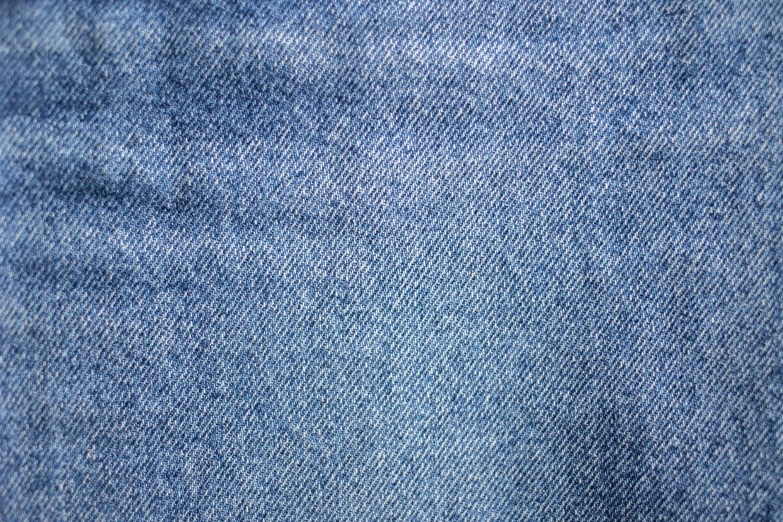 a close up of a pair of jeans, a stipple, pexels, tileable texture, highly detailed-h 704, wiry, blue clothing