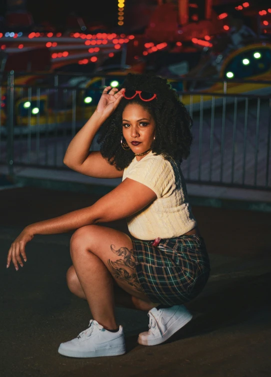 a beautiful young woman sitting on top of a skateboard, by Winona Nelson, pexels contest winner, lowbrow, full figured, ☁🌪🌙👩🏾, bra and shorts streetwear, mixed-race woman