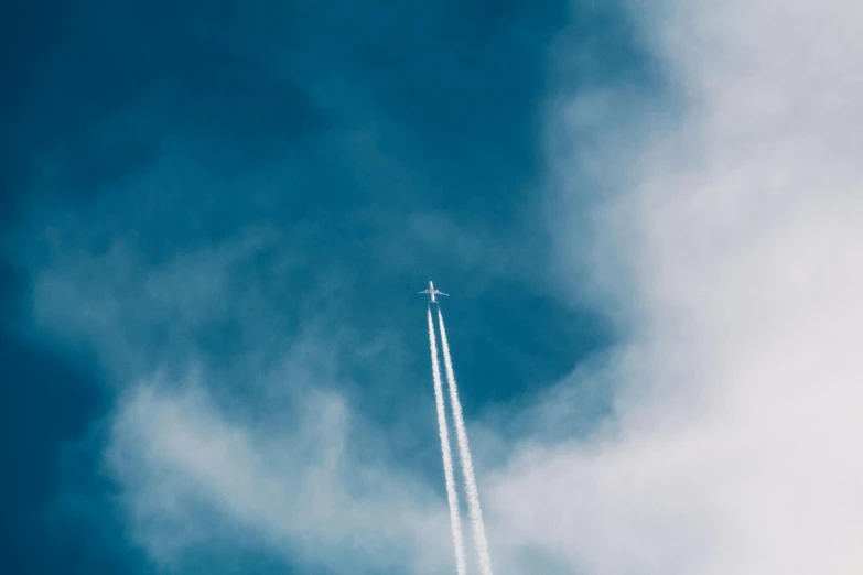 a jet flying through a cloudy blue sky, pexels contest winner, minimalism, rocket launching, thumbnail, birdseye view, multiple stories