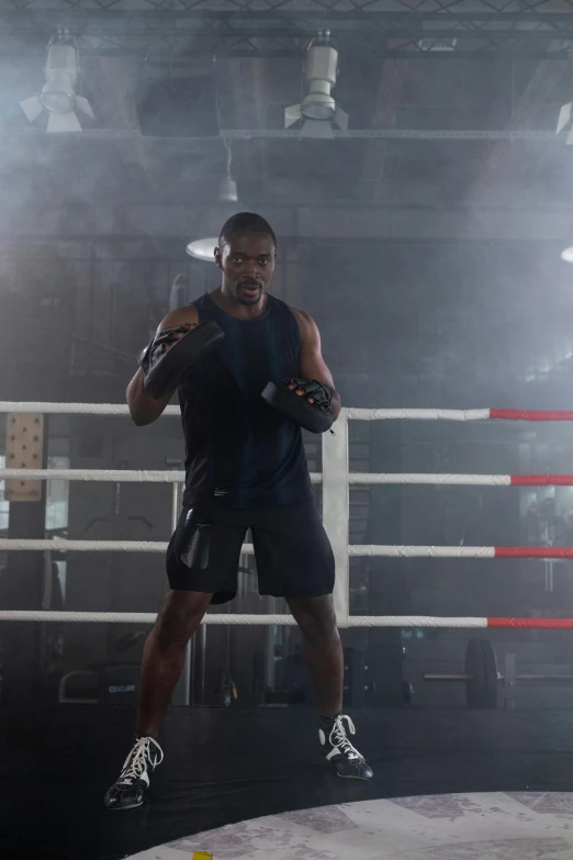 a man standing in the middle of a boxing ring, happening, studio spotlight, black lightning, in a gym, black man