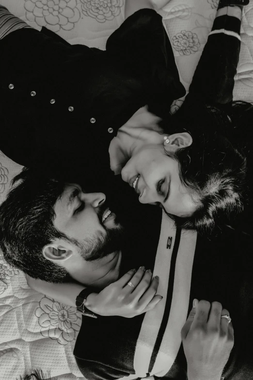 a man and a woman laying on top of a bed, a black and white photo, by irakli nadar, reddit, new song, sayem reza, vmk myvmk, i love you