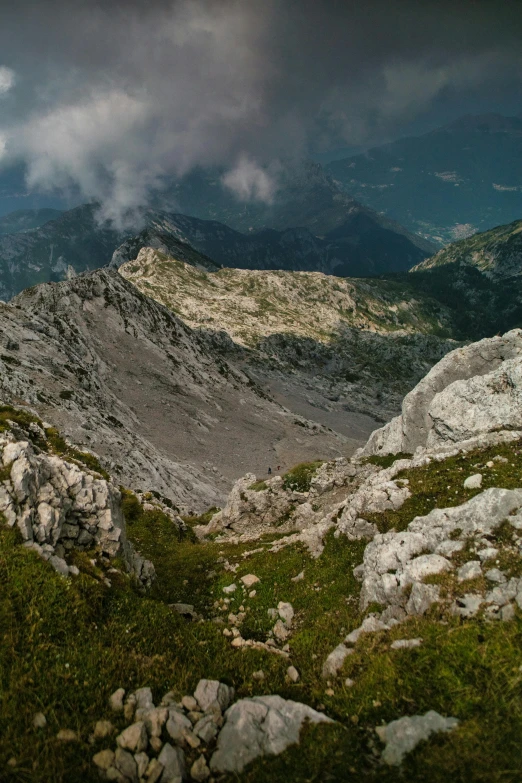 a group of people standing on top of a mountain, a picture, by Adam Szentpétery, baroque, panoramic view, limestone, boka, detailed photo 8 k